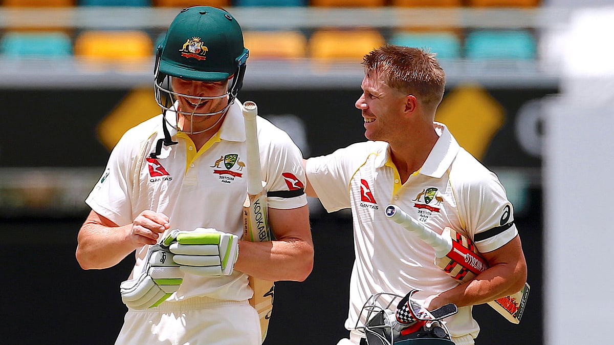  Australia’s Cameron Bancroft walks off the field with teammate David Warner after hitting the winning runs.