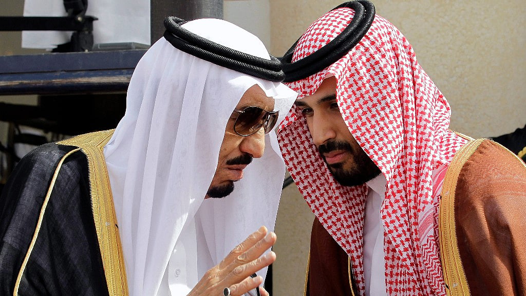 In this 14 May 2012 file photo, King Salman, left, speaks with his son, now Crown Prince Mohammed Bin Salman, (MBS), as they wait for Gulf Arab leaders ahead of the opening of Gulf Cooperation Council, in Riyadh, Saudi Arabia.