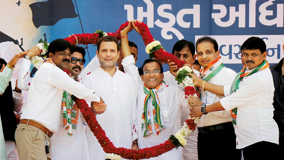 Rahul Gandhi being garlanded by the supporters during a public meeting in Killa Pardi in Valsad district on Friday
