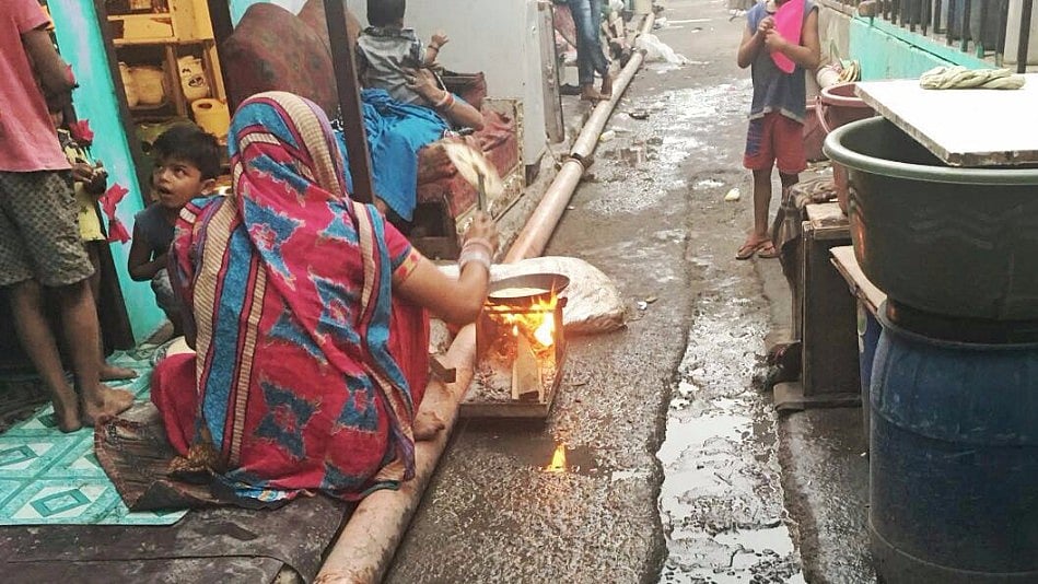 A woman cooks on a clay stove outside her house. Image used for representational purposes. 
