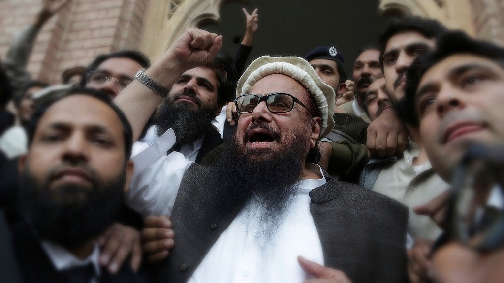 In this photo from 22 November 2017, the Lashkar-e-Toiba chief celebrates his freedom from house arrest after nearly 11 months.