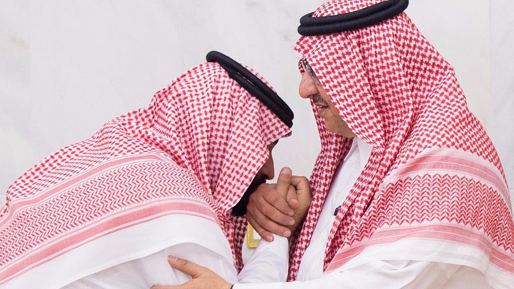 In this Wednesday, 21 June 2017 photo released by Al-Ekhbariya, Mohammed bin Salman (MBS), newly appointed as crown prince, left, kisses the hand of Prince Mohammed bin Nayef at royal palace in Mecca, Saudi Arabia. 