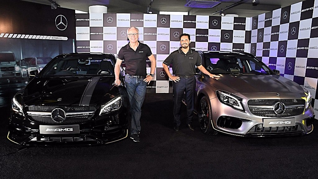 Mercedes-Benz India MD & CEO Roland Folger (left) with the AMG CLA 45 and the AMG GLA 45 4Matic.