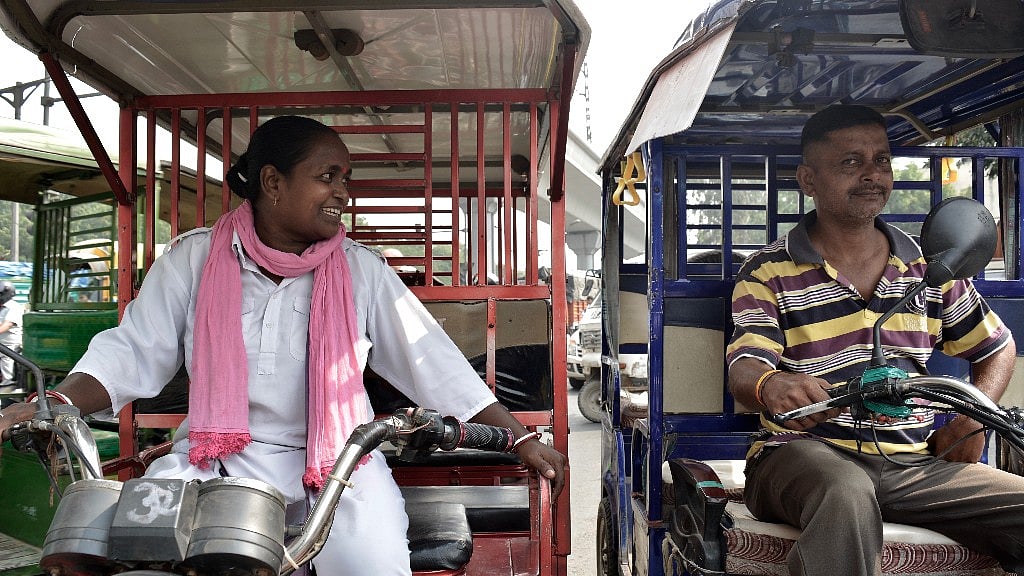 Binota maintains a good rapport with her fellow e-rickshaw drivers.