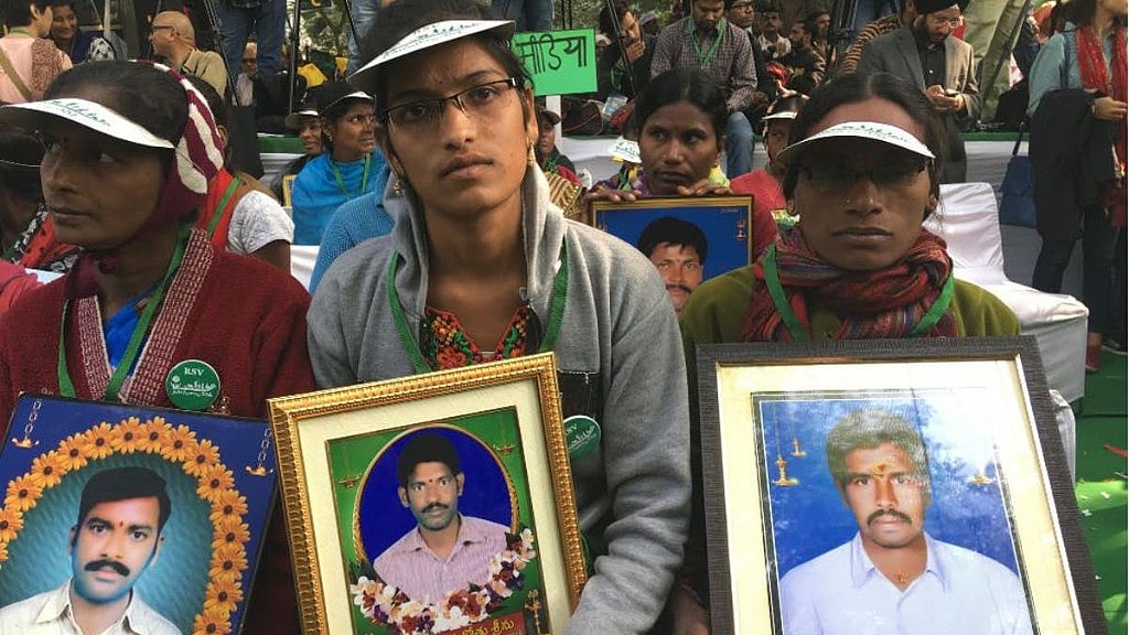 Family members of farmers who committed suicide participate in the rally in New Delhi. 