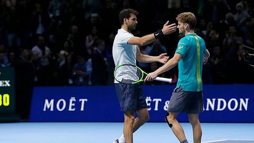 Winner Grigor Dimitrov of Bulgaria, left, hugs David Goffin of Belgium