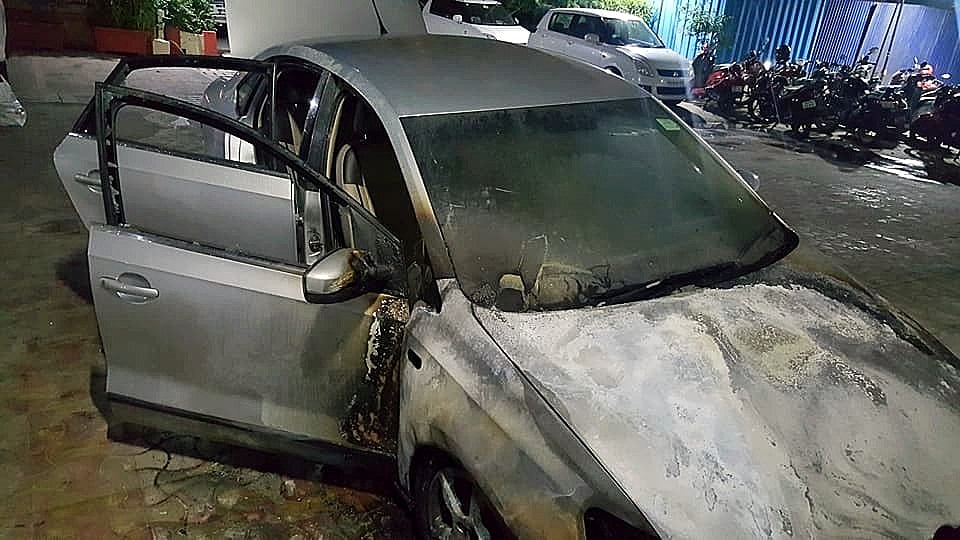 This Volkswagen Vento was set on fire in Mumbai by arsonists who arrived in a Mercedes M-Class SUV. 