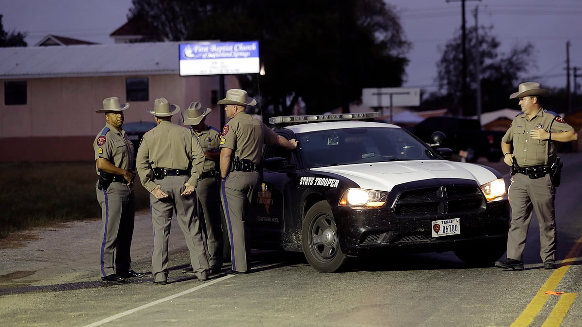 Law enforcement officials continue to investigate the scene of a shooting at the First Baptist Church of Sutherland Springs, Tuesday, 7 November, in  Texas.&nbsp;
