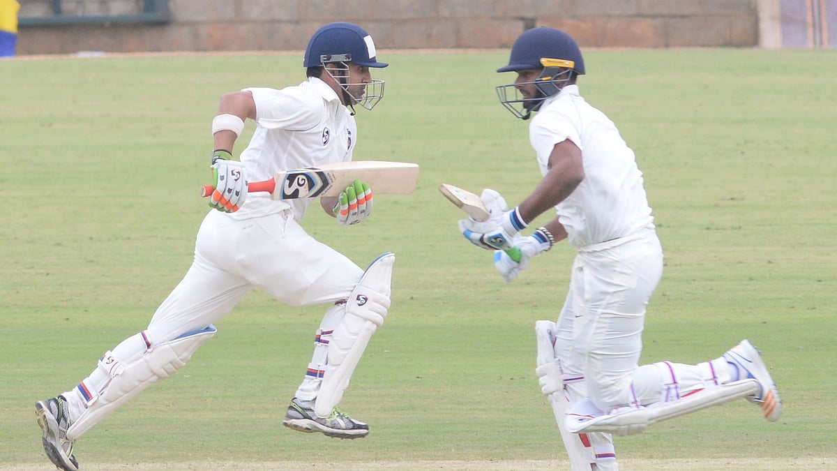 Gautam Gambhir and Rishabh Pant take a run during a Ranji Trophy match.