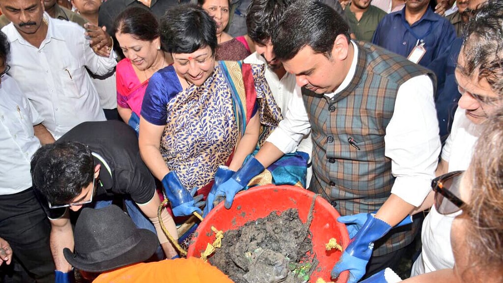 Maharashtra Chief Minister Devendra Fadnavis joins the Versova beach clean-up drive on Sunday.