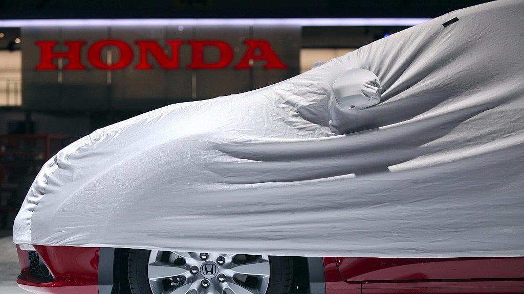 A protective cover sits over a Honda Jazz automobile on the company’s stand, ahead of the opening press day at the Geneva International Motor Show in Geneva. 