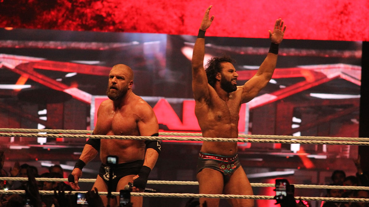 Triple H and Jinder Mahal gesture to the crowd after their fight at the WWE event in New Delhi on Saturday. 