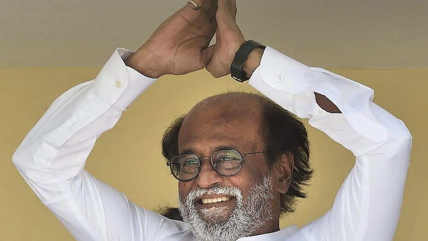 Tamil actor Rajinikanth gestures at his fans after announcing his political debut on the final day of his six-day-long meet with fans, in Chennai on Sunday. 