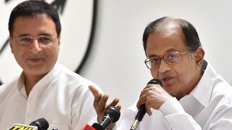 File photo of former Union Minister P Chidambaram with Congress chief spokesman Randeep Surjewala.