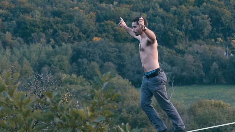 Theo Sanson moonwalks on a slackline, inspired by Michael Jackson.