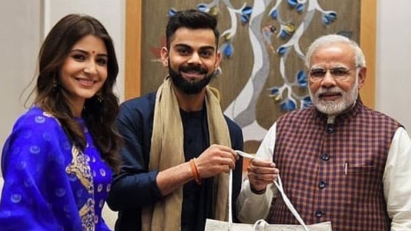 Virat kohli and Anushka Sharma with Narendra Modi.