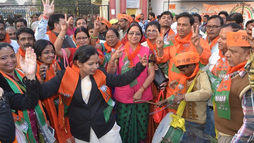 BJP workers dance as their party secures a victory in the UP civic polls. 