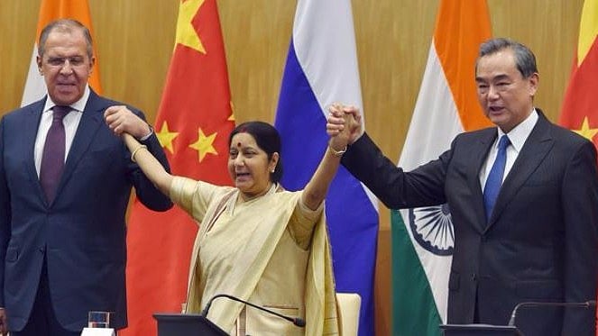 Union Minister for External Affairs Sushma Swaraj with her Chinese counterpart  Wang Yi and Russian Foreign Minister Sergey Lavrov at a joint press conference following the Russia-India-China Foreign Ministerial Meeting in New Delhi on 11 December. &nbsp;