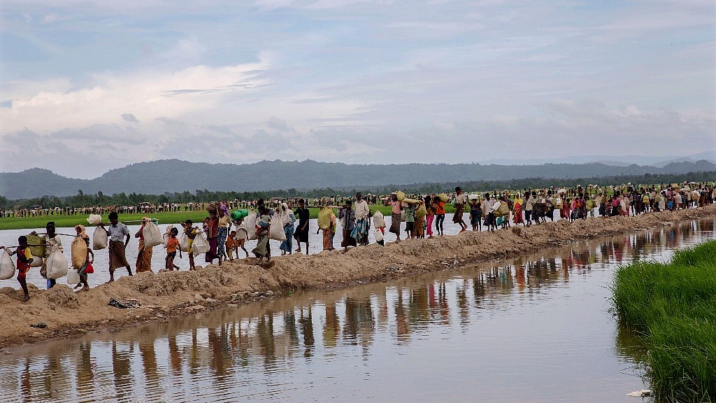 Rohingya Muslims proceed to a refugee camp at Palong Khali, Bangladesh, on 19 October 2017.