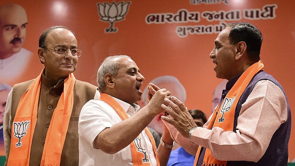 Finance Minister Arun Jaitley, Deputy CM of Gujarat Nitin Patel and CM Vijay Rupani. 