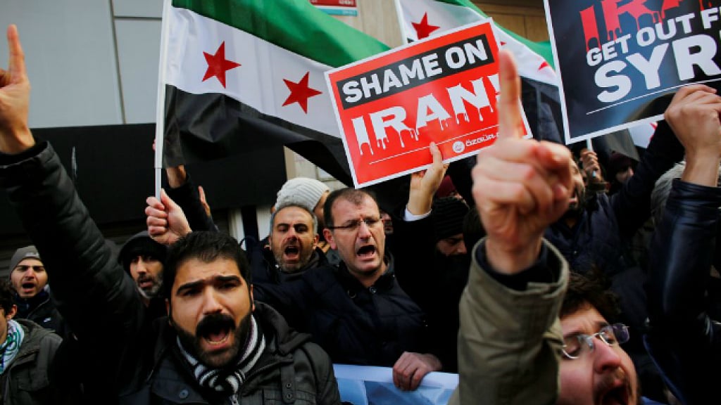 Demonstrators shout slogans during a protest against Iran’s role in Aleppo, near the Iranian Consulate in Istanbul, Turkey. 