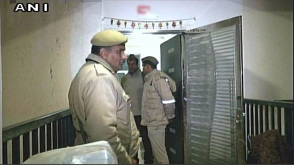 Police in front of the Greater Noida flat where the incident occurred. 
