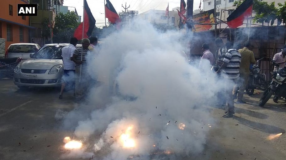 DMK supporters celebrate in Tamil Nadu after Kanimozhi was acquitted in the 2G scam.