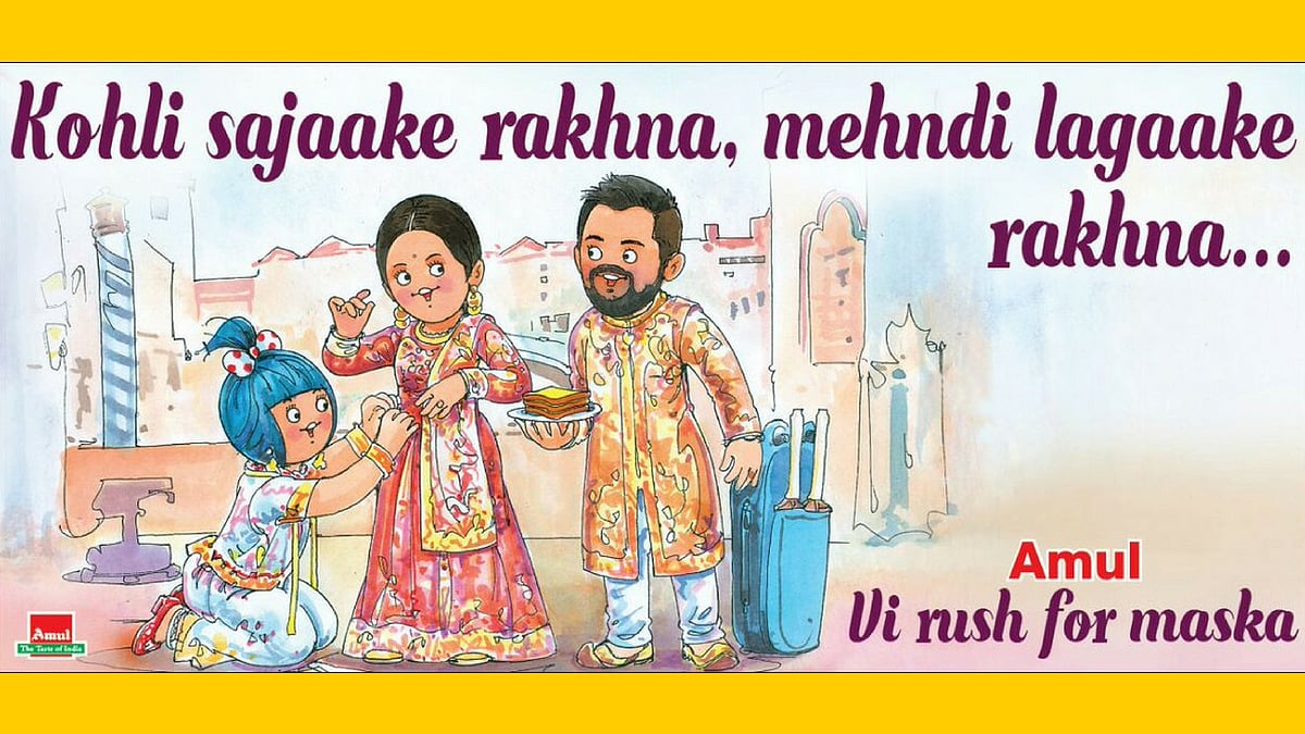  Amul girl adjusts Anushka Sharma’s lehenga.&nbsp;