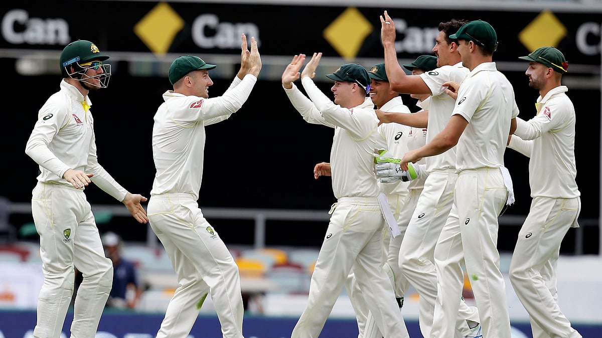 The Australian Team celebrate a wicket during the first Ashes Test.