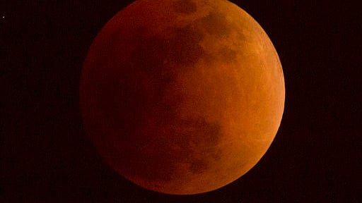 The moon turns a reddish hue as it passes through the Earth’s shadow during a lunar eclipse. (File photo used for representation only)