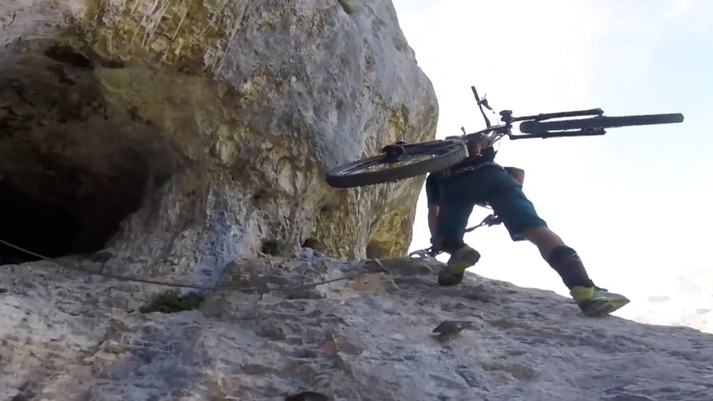26-year-old Kilian Bron combines rock climbing with mountain biking.
