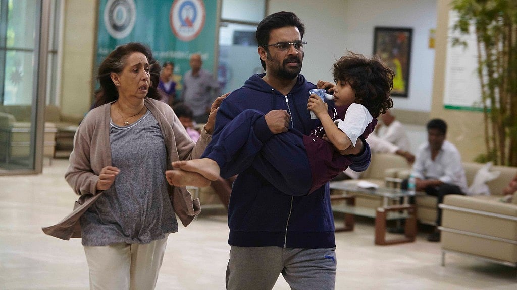 R Madhavan, Neena Kulkarni and Atharva Vishwakarma in <i>Breathe</i>.