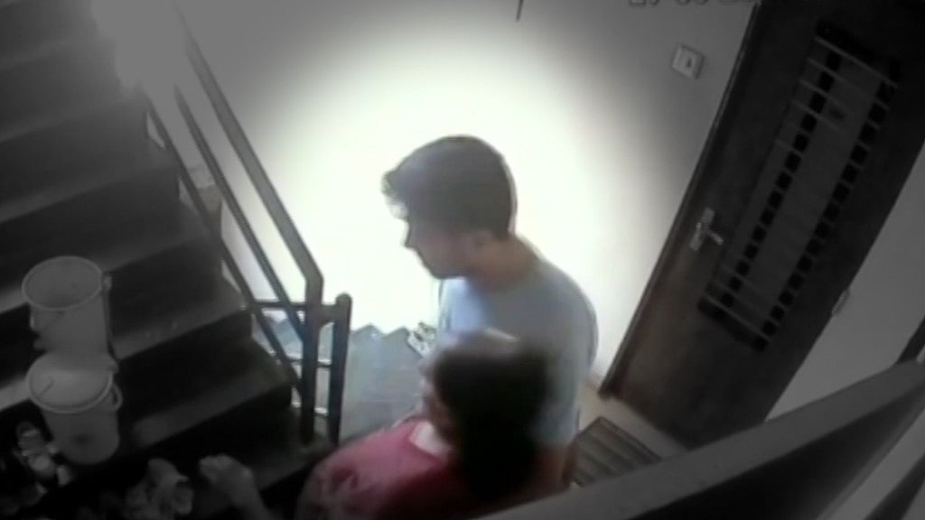 Son taking his mother to the terrace throw her off