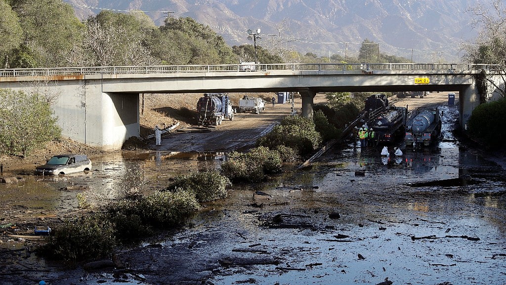 Crews work on clearing Highway 101 in the aftermath of a Mudslide in Montecito, California.
