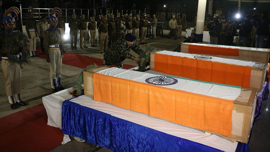 Soldiers lay wreath at the mortal remains of the four CRPF troopers killed in Jammu and Kashmir’s Pulwama district in Srinagar on 31 December. 