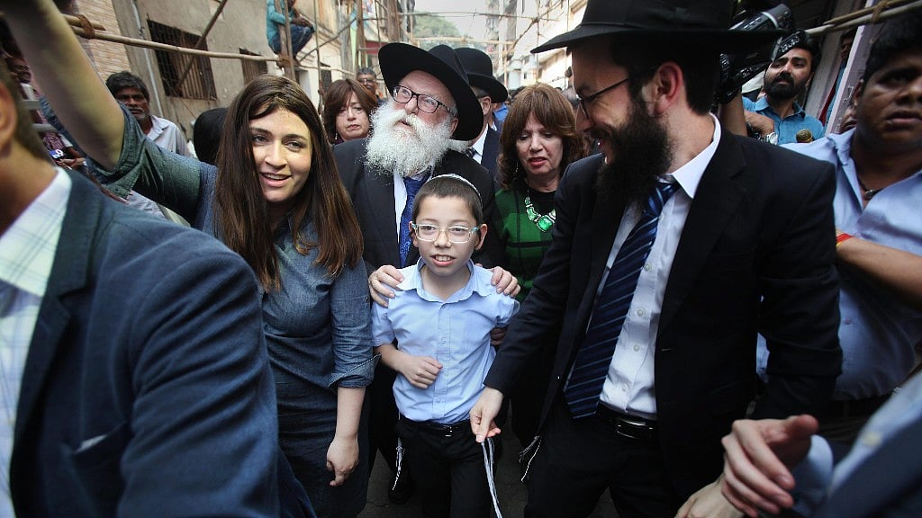 Israeli boy Moshe Holtzberg, who lost his parents during the 26/11 Mumbai terror attacks, arrives at Nariman House in Colaba, in Mumbai on Tuesday. 