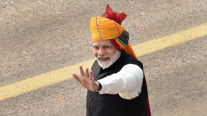 Prime Minister Narendra Modi waves at the crowd during the 69th Republic Day Parade at Rajpath in New Delhi, on Friday. 