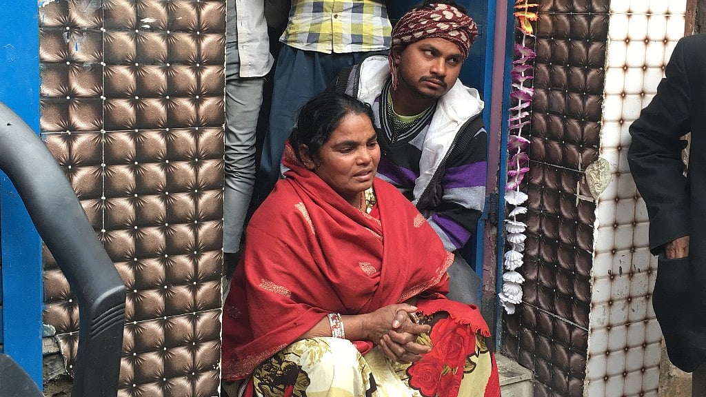 Kiran Devi grieves  her sister Baby Devi, who died in the fire at a factory unit in Bawana.