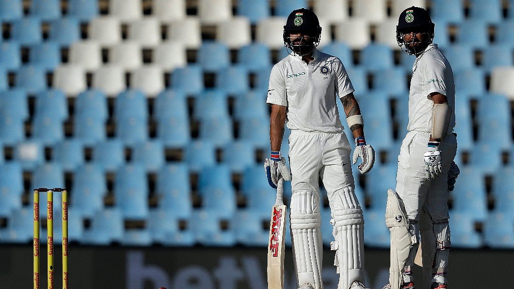 India’s captain Virat Kohli, left, chats with Cheteshwar Pujara at the Centurion Park in Pretoria, South Africa.