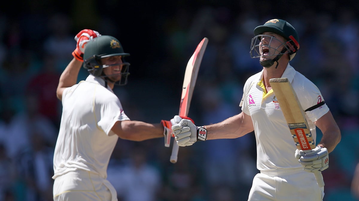 Australia’s Shaun Marsh (right) celebrates after his century against England with brother Mitchell Marsh during the fourth day of their Ashes cricket test match in Sydney.