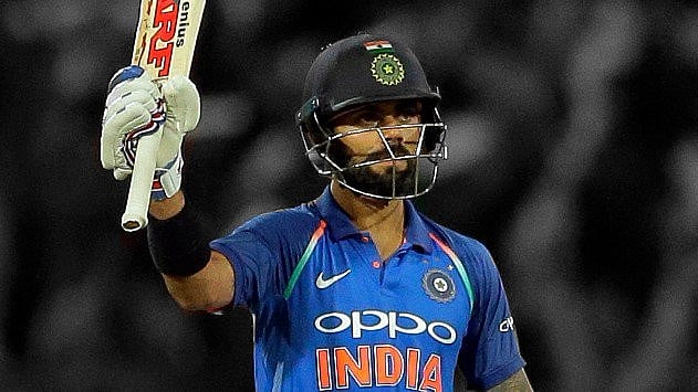 Virat Kohli raises his bat after scoring a century in an ODI against Sri Lanka in Colombo.