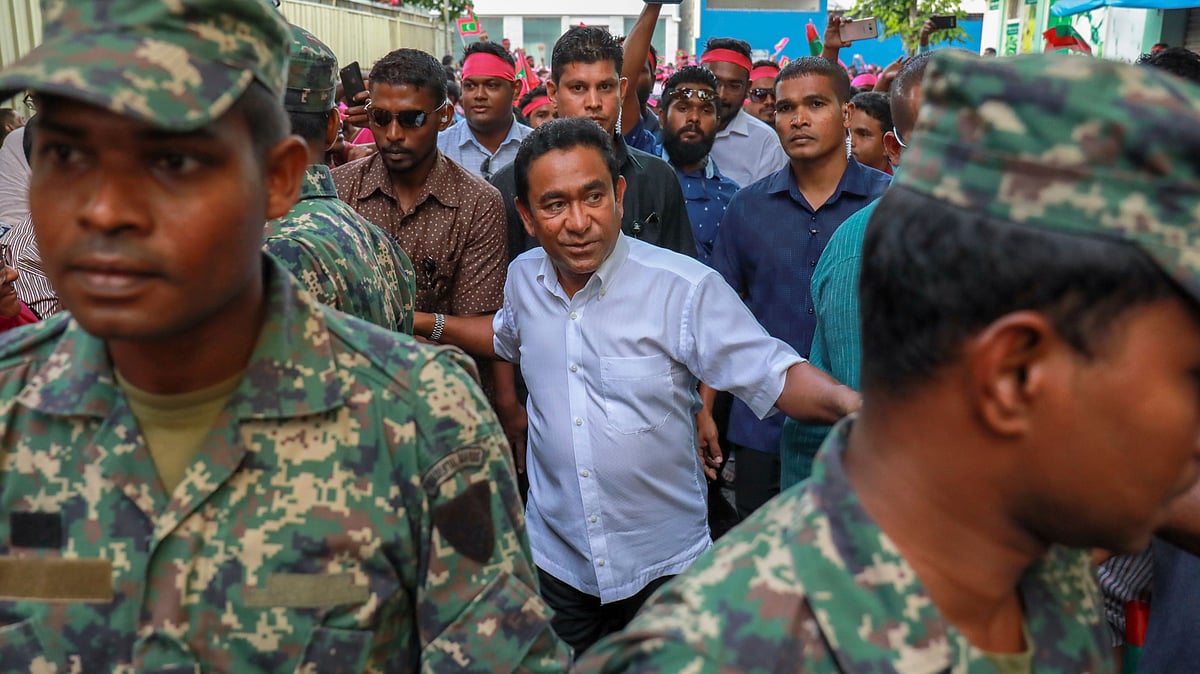 Maldivian President Abdulla Yameen, centre, surrounded by his bodyguards in Male, Maldives. 