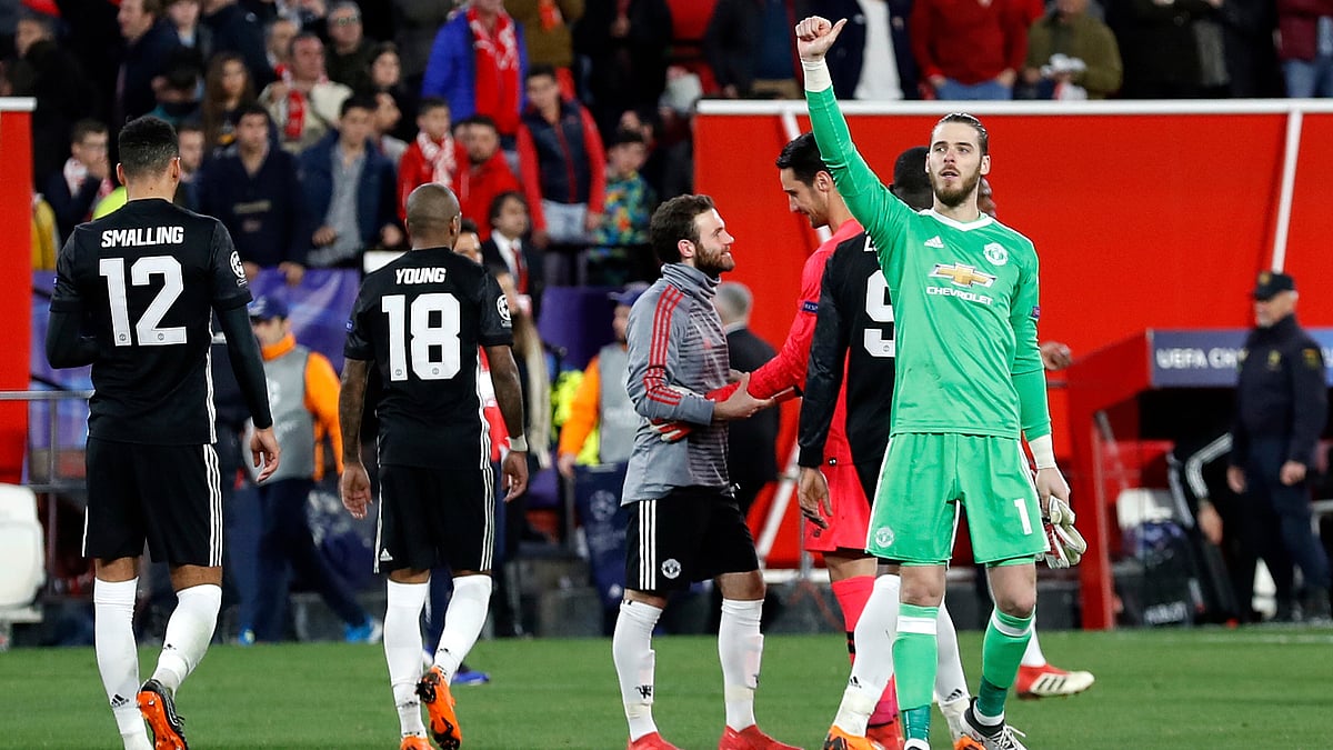 Manchester United goalkeeper David de Gea (right) gestures to the supporters at the end of the Champions League round of sixteen match against Sevilla FC.