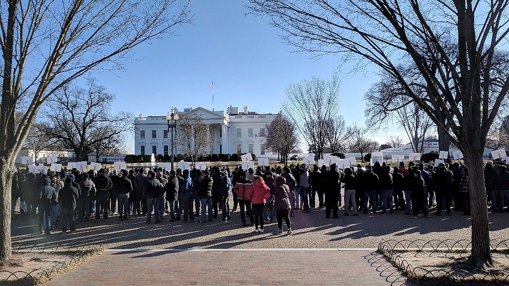Hundred highly-skilled Indian workers hold a rally to end the per-country limit on legal permanent residency so as to eliminate the massive Green Card backlog.