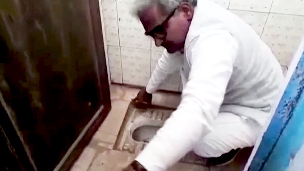 BJP MP Janardan Mishra cleans school toilet.