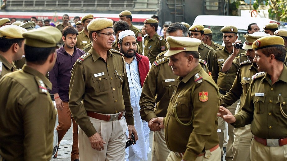 Aam Aadmi Party (AAP) MLAs Amanatullah Khan and Prakash Jarwal being produced at Tis Hazari court in New Delhi, on Thursday. 