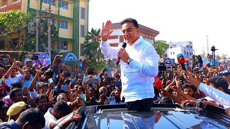 Kamal Haasan addresses a crowd gathered to see him.