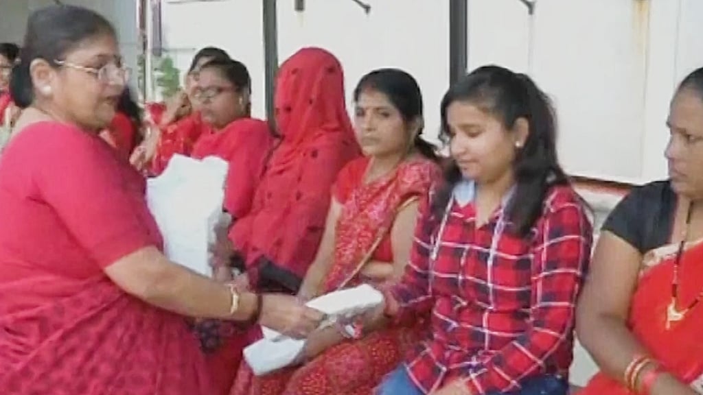 Couple from Surat distributes free sanitary pads to women.