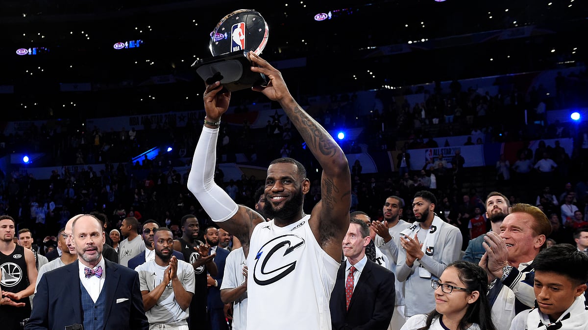 Team LeBron’s LeBron James, of the Cleveland Cavaliers, holds the MVP trophy after his team defeated Team Stephen at the NBA All-Star basketball game, Sunday, Feb. 18, 2018, in Los Angeles. Team LeBron won 148-145. 