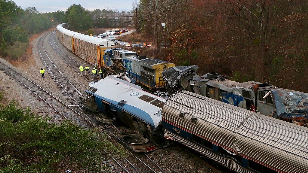 Authorities investigate the scene of a Amtrak train crash in Cayce, South Carolina